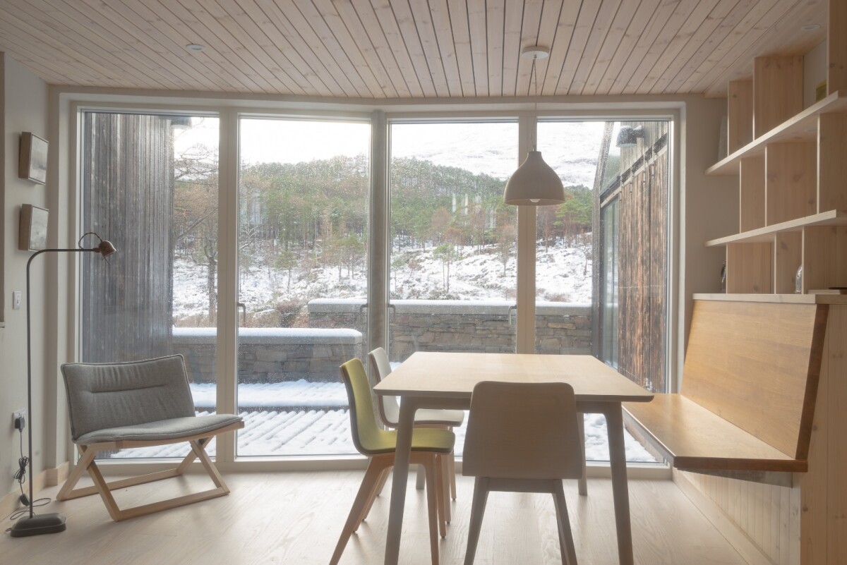 Lochside House includes generous glazing to frame the beautiful rugged landscape