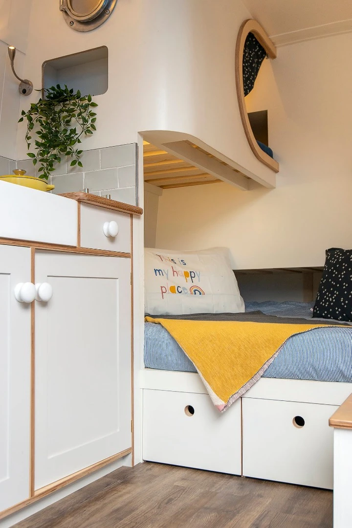 The vertical matchboard styling is a classic interior design trick to give the illusion of additional headroom