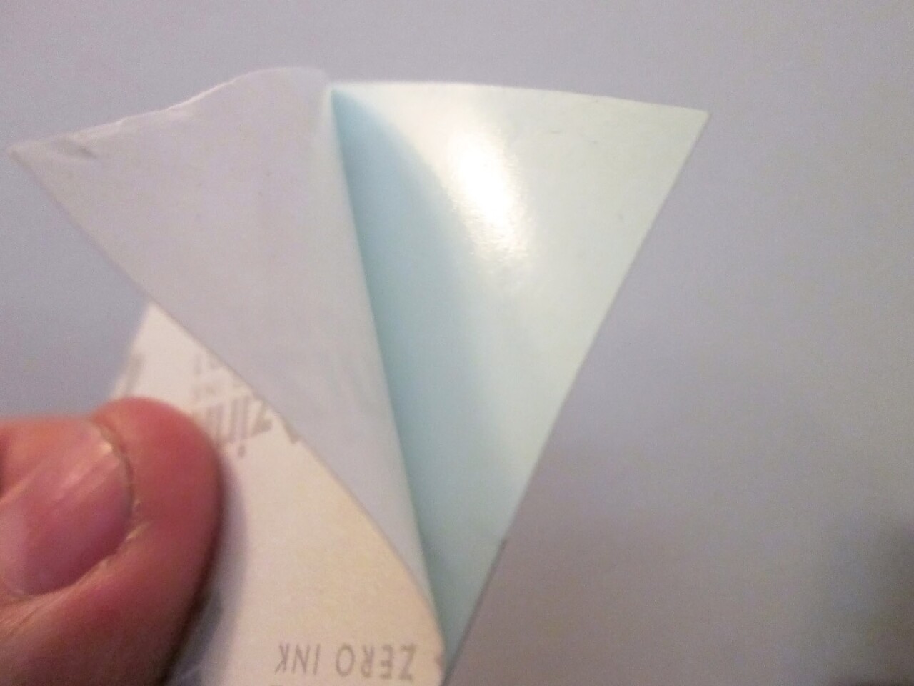 The Polaroid Zip paper has a peel-off sticky back