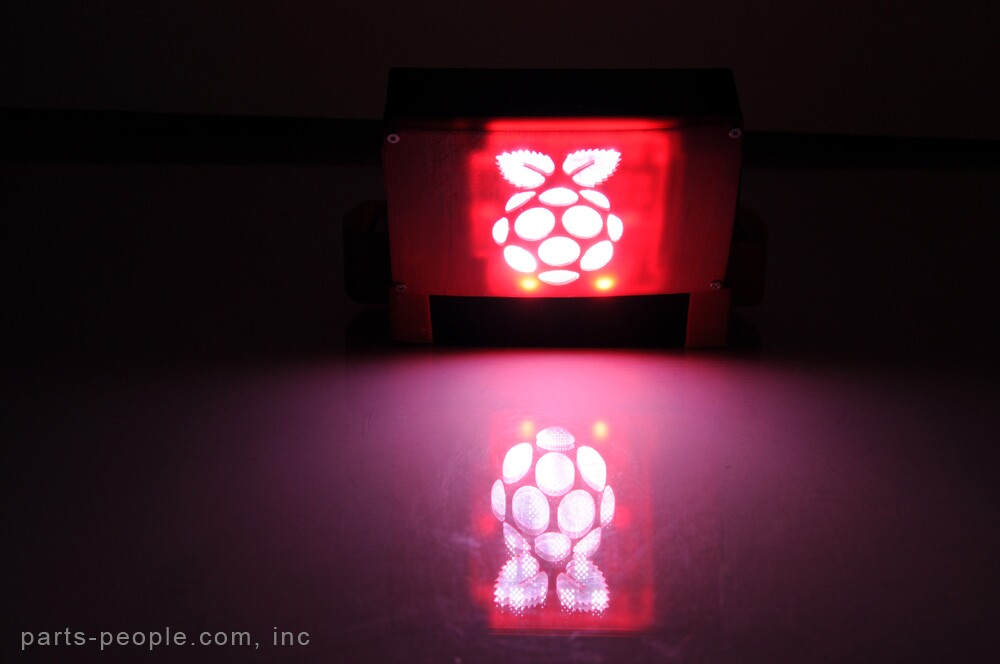 There's a cut-out Raspberry Pi logo on the back panel, through which shines LED backlighting kindly donated from a backlit laptop keyboard