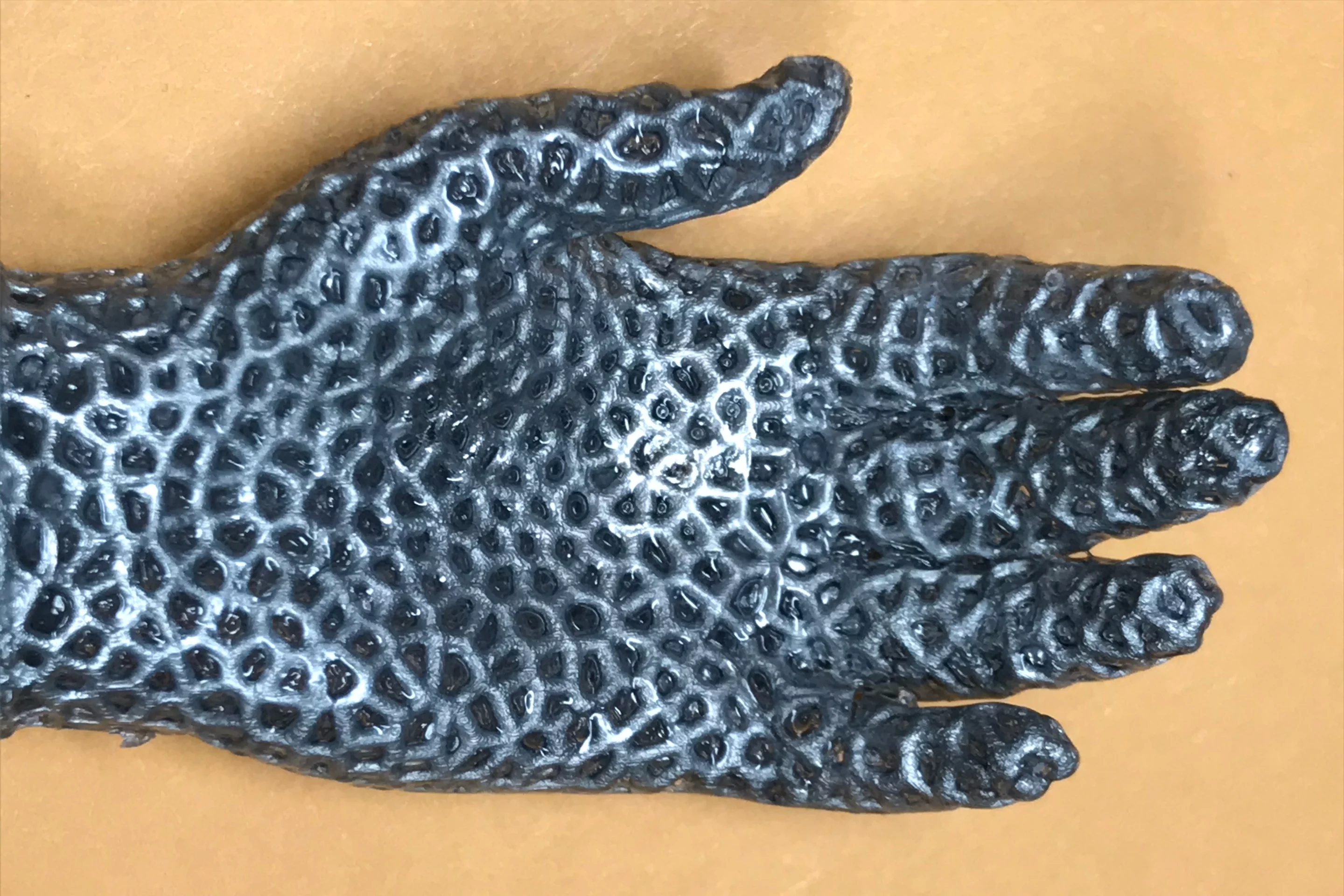 Made of the liquid metal lattice, this hand opens as it's heated