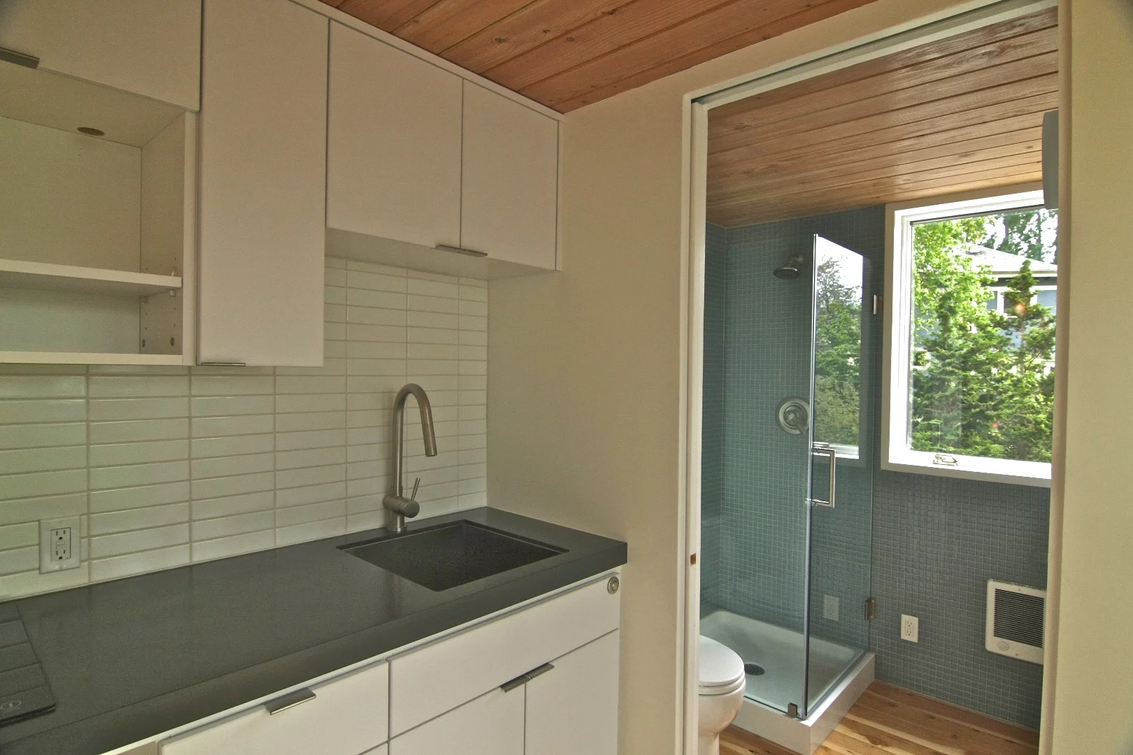 Inside, there's a kitchen, lounge area and bathroom with shower and toilet downstairs, while upstairs includes a small sleeping area