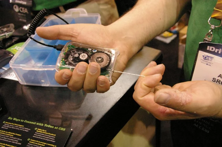 The YoGen charger shown here at CES 2010, uses your energy to power the batteries of most portable electronic devices