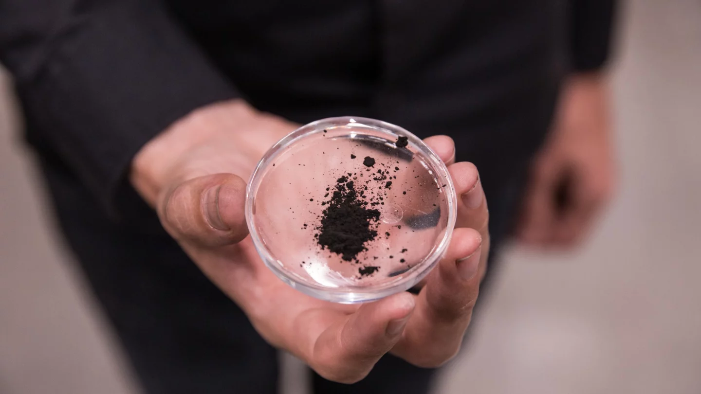 Particles captured by the Smog Free Tower are collected and compressed into cubes for jewelry