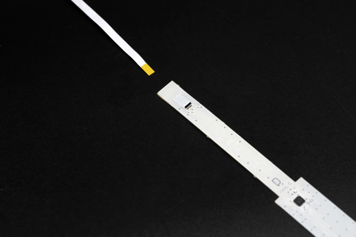 Each sensor strip connects to a narrow controller board via flat-flex cables
