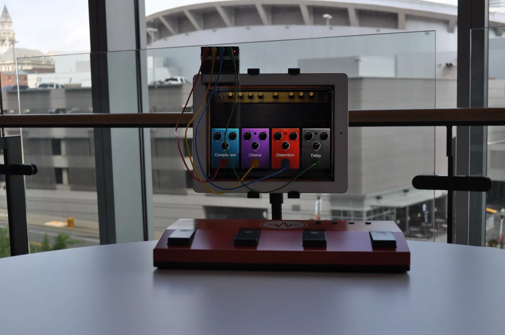 Four colored Touch Pointers are positioned above the parts of the smart device display where a user wants to click and held in place with suction pads