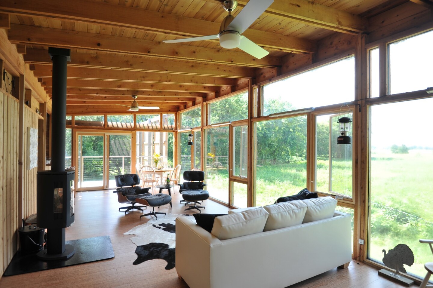The Glass Cabin's interior is dominated by a living room