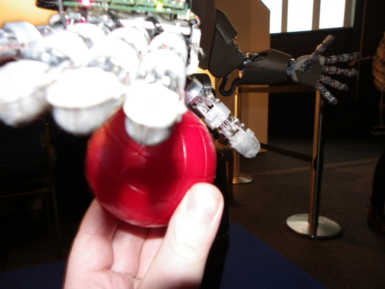 iCub can recognize, reach out for, and take familiar objects, emoting all the way (Photo: Gizmag)