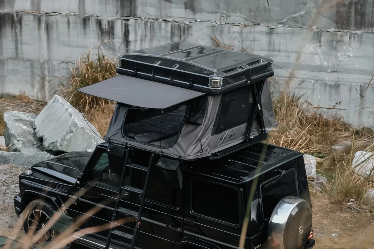 Lifted Rooftop On Rv Wild Land's Sky Rover rooftop tent offers RV amenities and a pneumatic ...