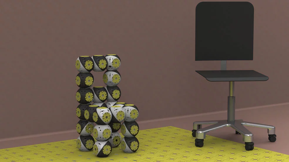 A chair from 12 Roombots modules, and a typical office chair for size comparison (Photo: Biorobotics Laboratory, EPFL)