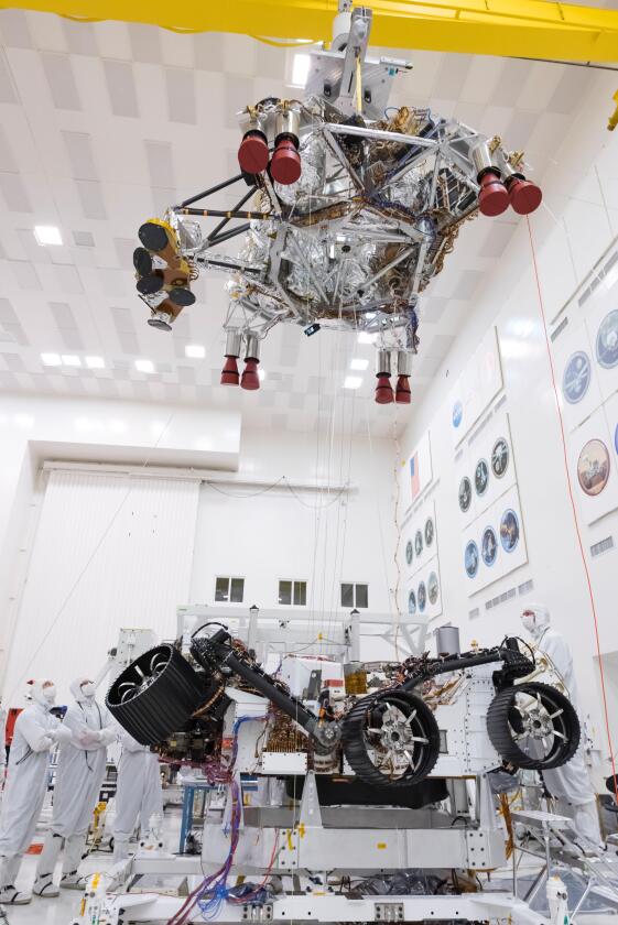 The descent stage being lifted away from the rover