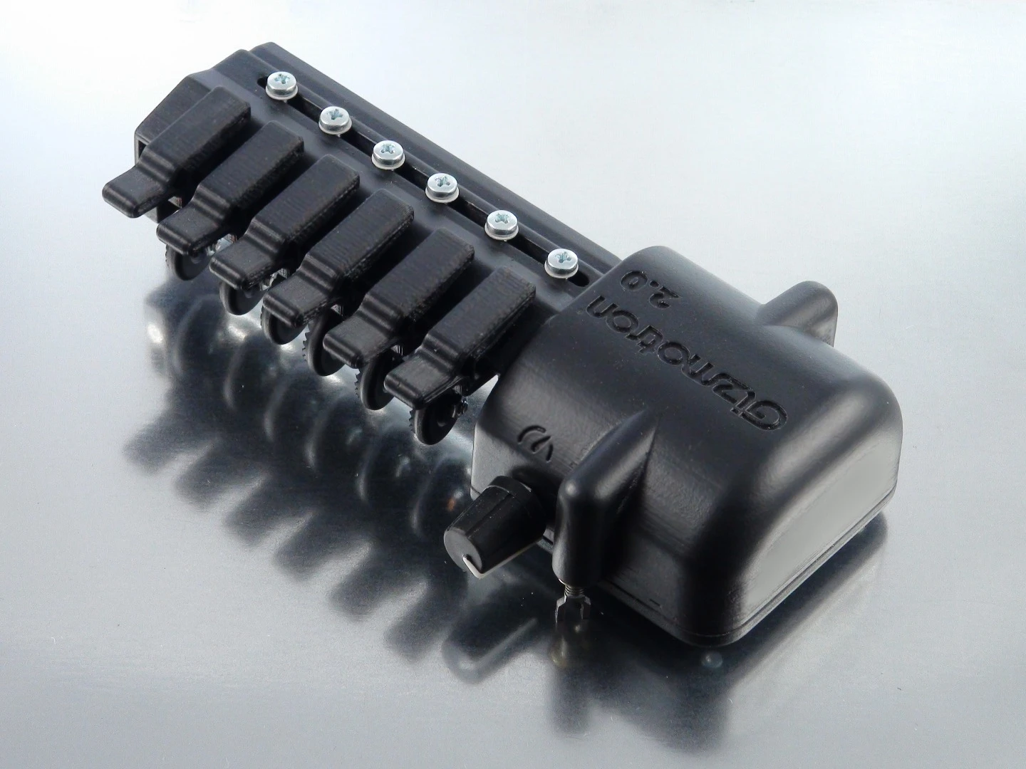 A user can push down one or more keys simultaneously while fretting at the neck