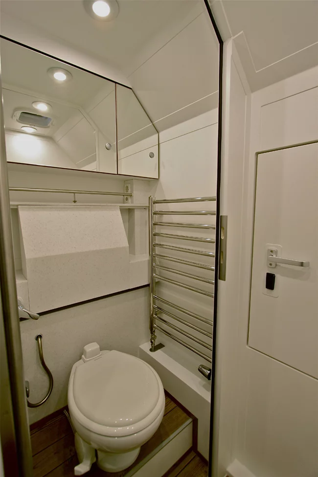 The fold-away sink makes strategic use of the small bathroom space