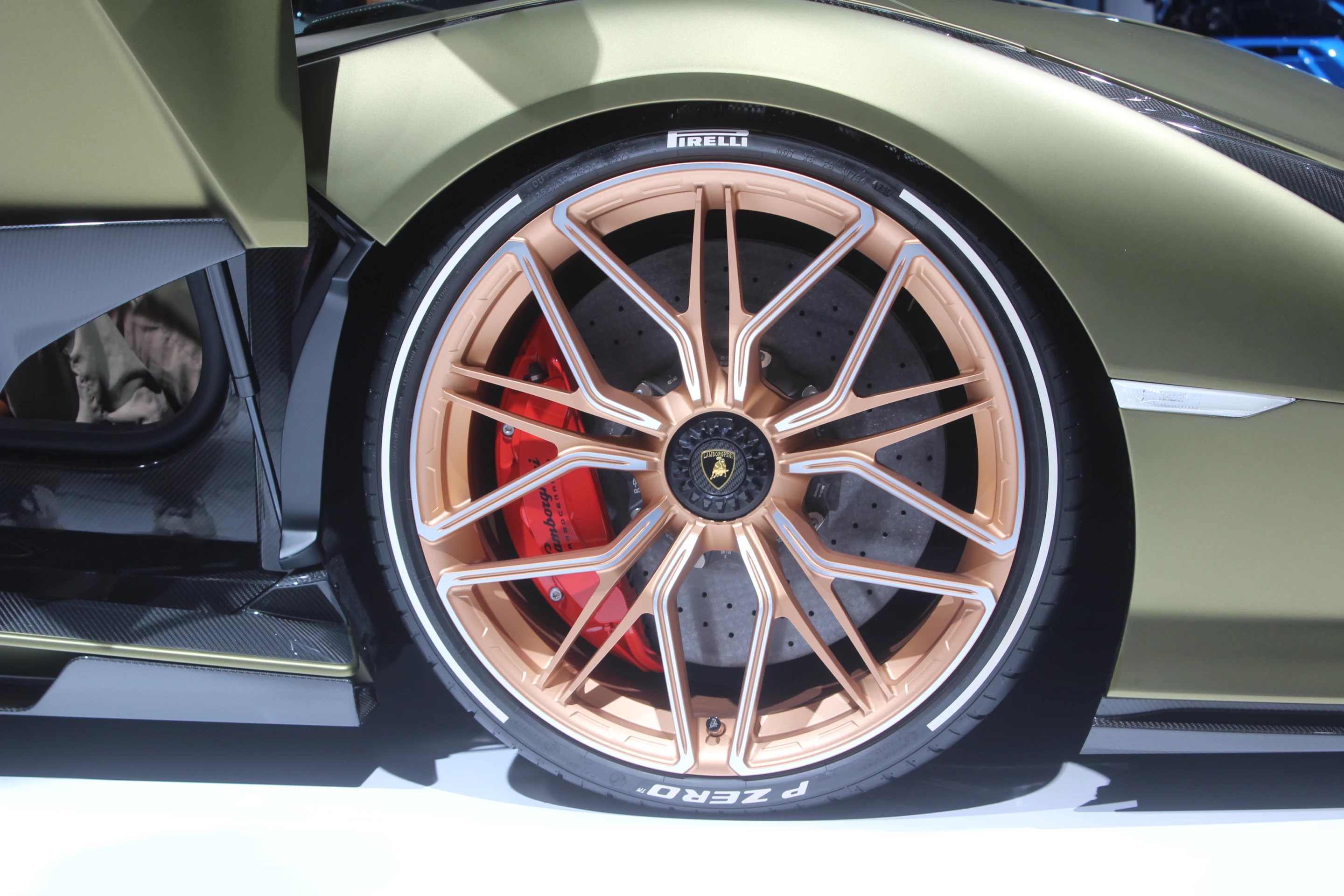 The copper-tinted wheels hint at the electrical nature of this particular Lamborghini