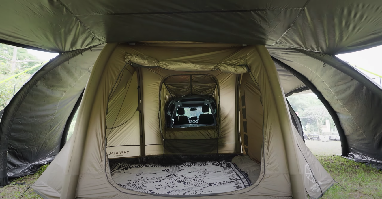 A vehicle interior inside the Smart Shell inside the Magic Fort – rooftop tent camping meets base tent camping meets in-vehicle camping