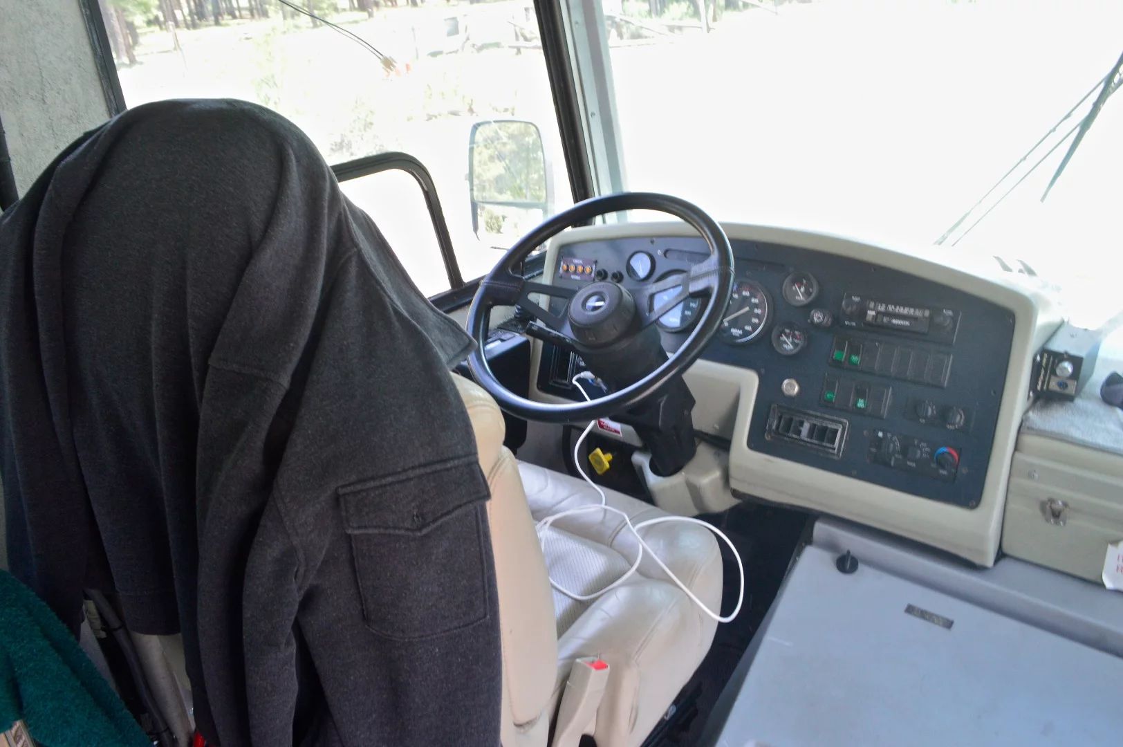 At the wheel of the bus-turned-motorhome on display in the special exhibition vehicles section of OX West 2017