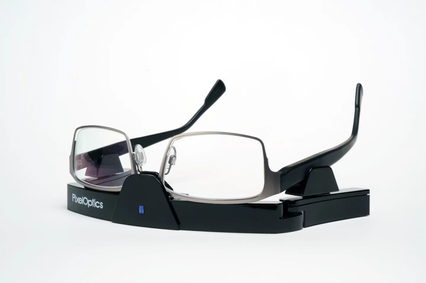 PixelOptics' emPower! electronic focusing glasses, in their charging stand