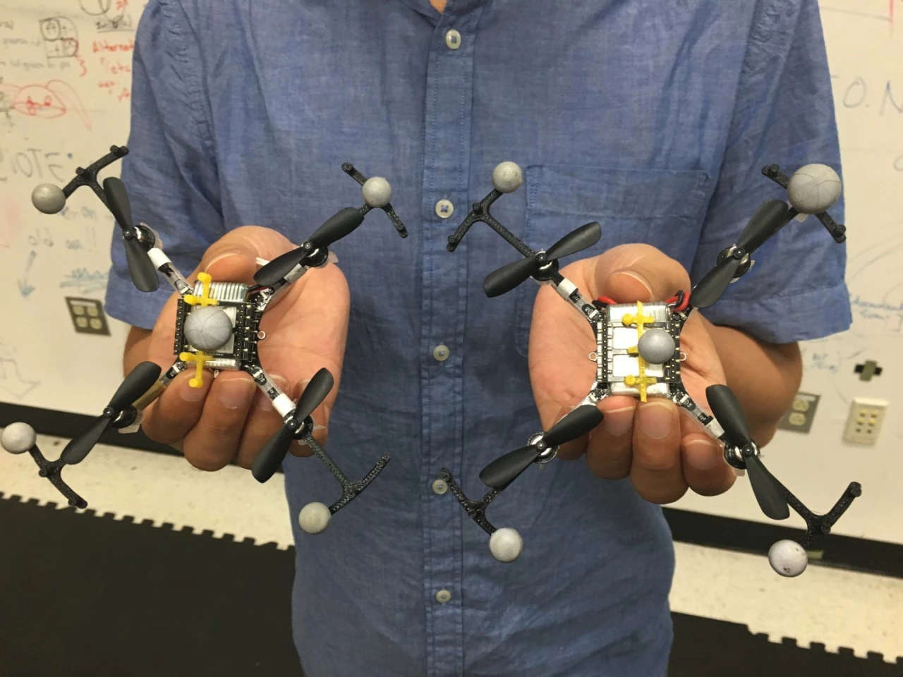 A Georgia Tech team is developing drones with "virtual top hats", allowing them to fly in formation safely