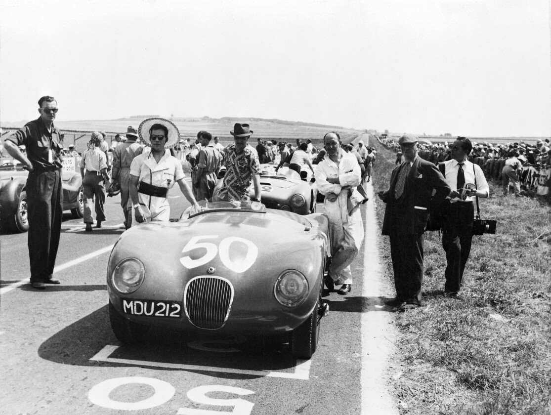 In 1952, the Jaguar C-type won the Reims Grand Prix in the hands of Sir Stirling Moss Jaguar secured the first win for a disc-braked car with the C-type (XKC 005) in 1952. Sir Stirling Moss recorded the win at Reims in a sports car race supporting the French Grand Prix.