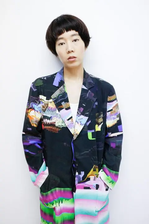 The Glitch Coat by Nukeme is a glitch design printed onto a plastic lab coat
