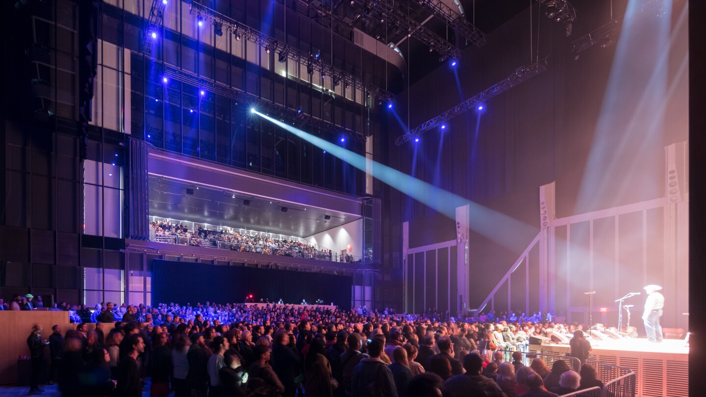 A huge section of The Shed's exterior moves along a series of wheels guided by a pair of huge rails, allowing it to create a flexible events space