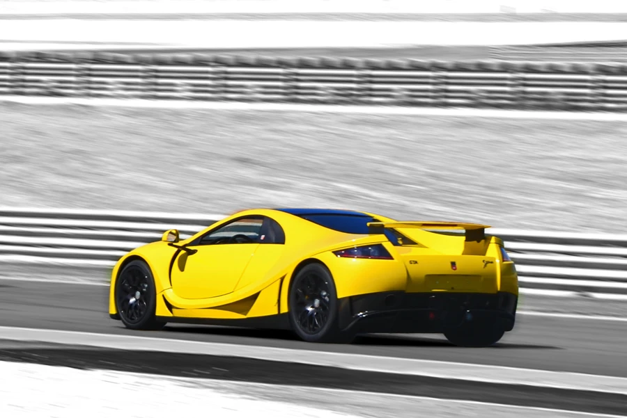 The rear shows a Carerra GT like wing and tail lights similar to a Tesla Roadster