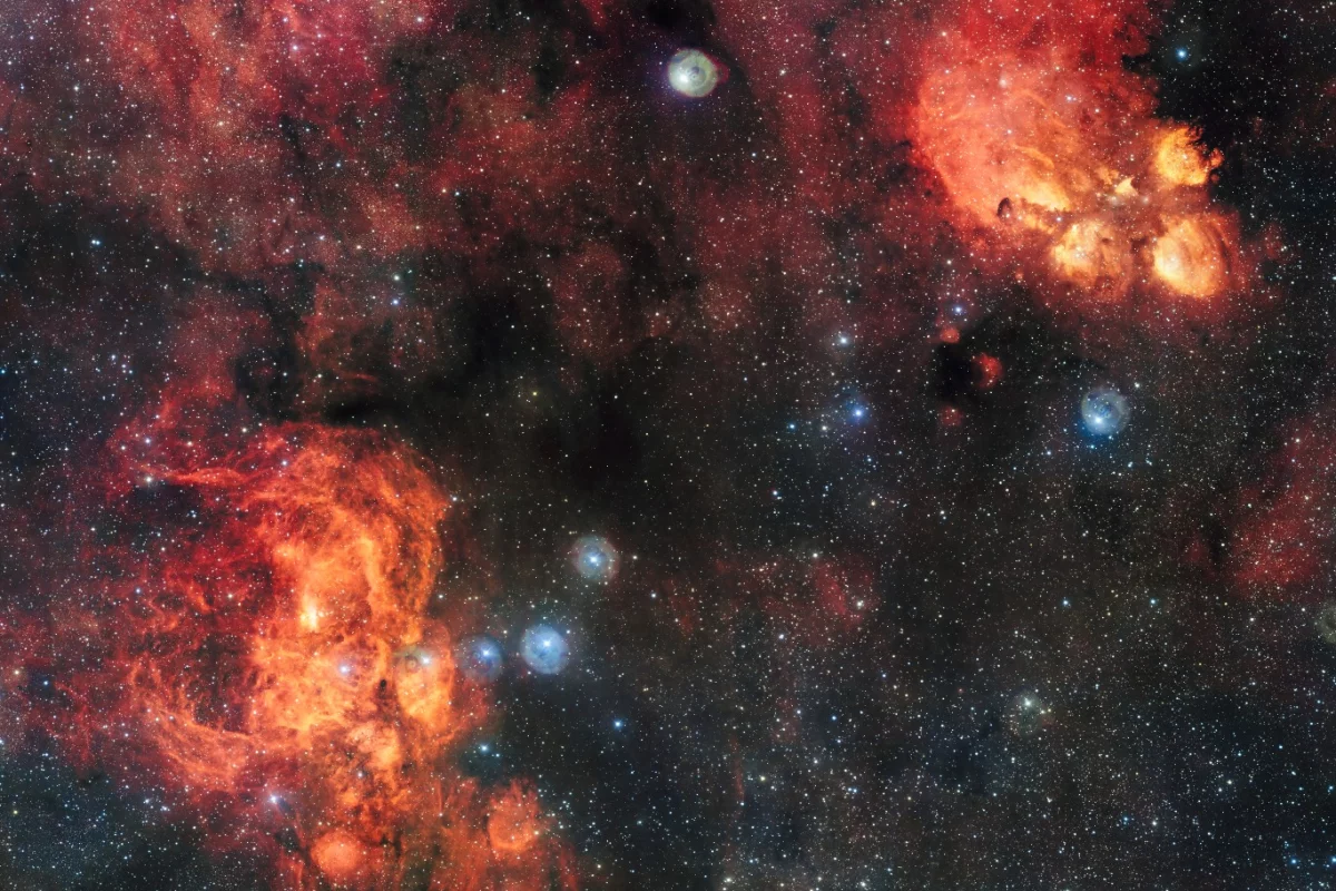 Though they appear side by side in the image, the Cat's Paw Nebula (top right) is far closer at 5,500 light-years, than the Lobster Nebula (bottom left), which sits roughly 8,000 light-years from Earth