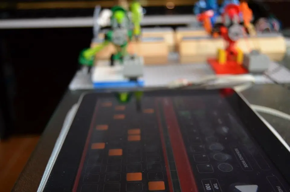 Each bot's arms are controlled by an Arduino Uno connected to an iPad running Nord Beat, a MIDI sequencer app