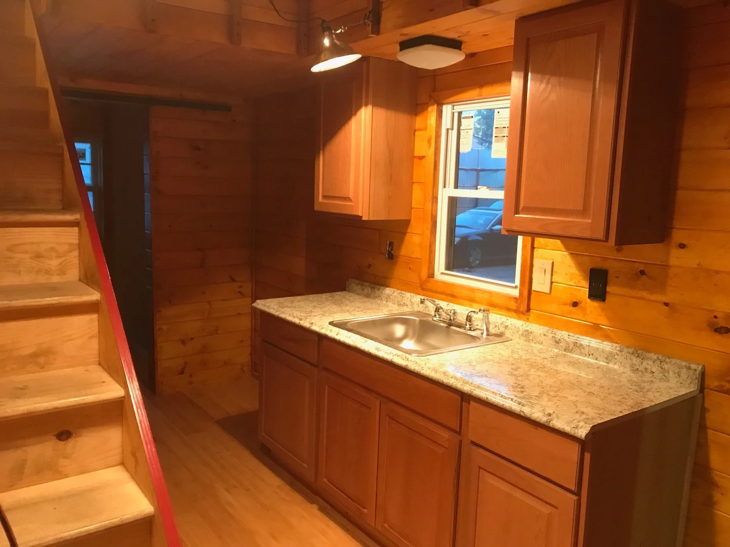 The Devasa's kitchen has no appliances but does have the cabinets installed