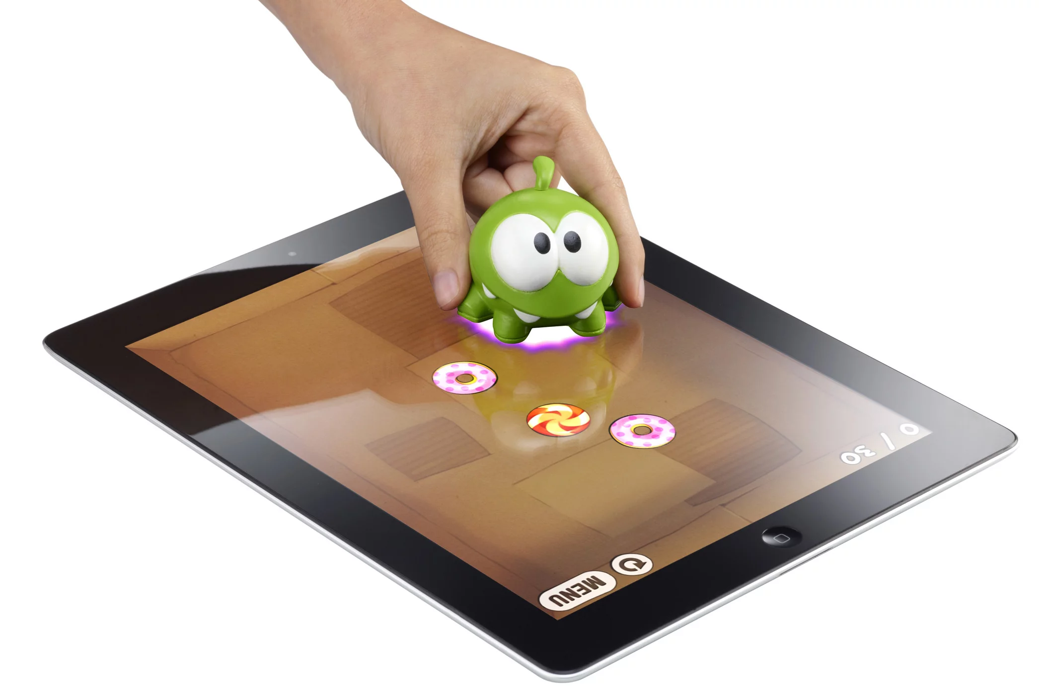 In the Cut the Rope Apptivity app, the green character of Om Nom is moved across the screen to capture candy