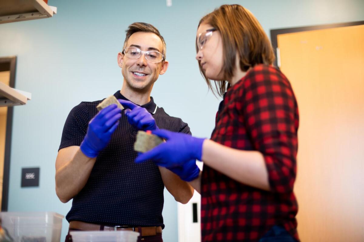 Wil Srubar and CU Boulder graduate student Sarah Williams, with samples of the brick