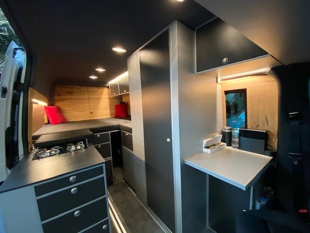Between the two trade show appearances, VanEssa found it necessary to cover the interior in wood, providing some insulation from the winter air outside