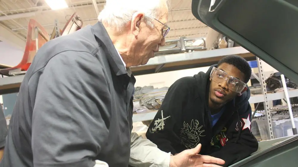 Mentor Buck Buchner and student Kelvin Duly discuss the finer points of electric conversion