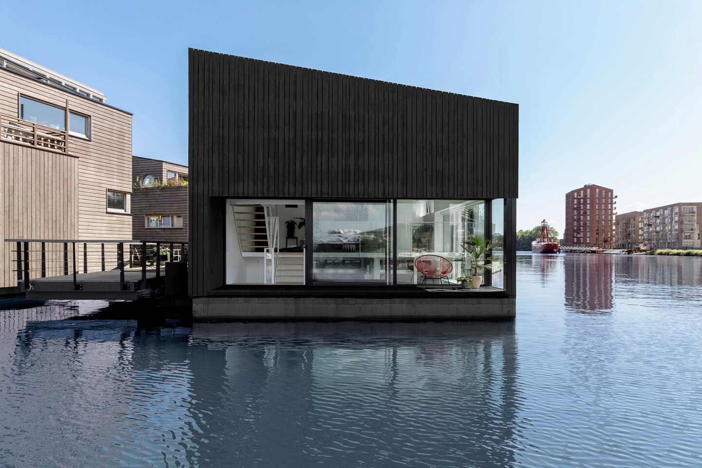 The home features a pitched roof, open interior living zones and an abundance of natural light