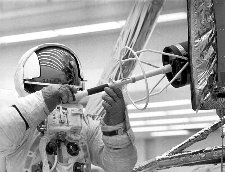 Haise practices removing the nuclear fuel canister from the Lunar Module