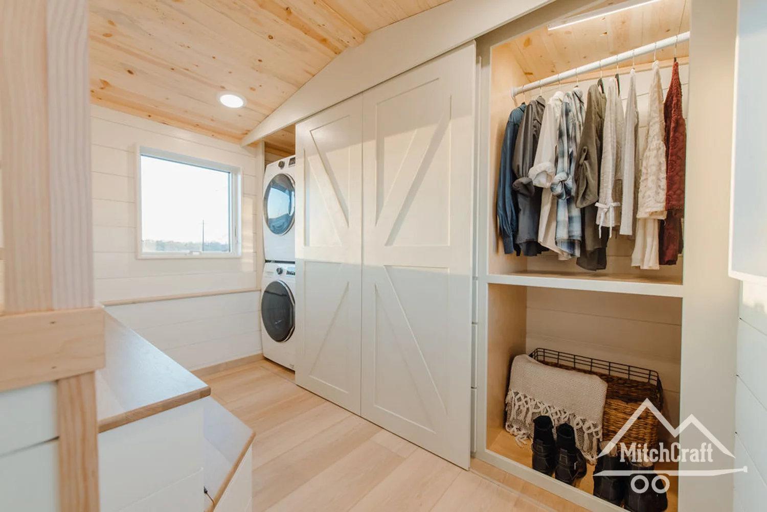 Full-sized walk-in closet with dryer and washing machine