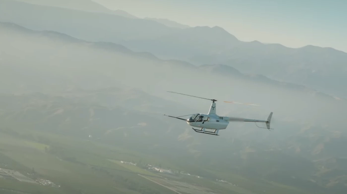 The Robinson R-66 begins to plummet in the world's first automated autorotation landing
