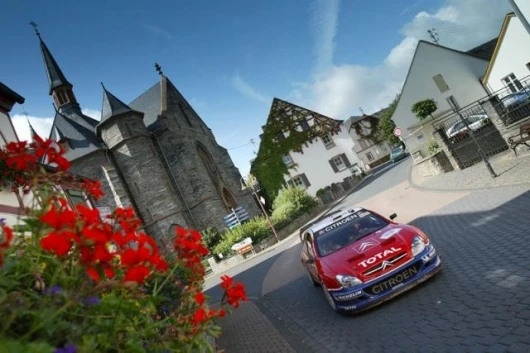 Champion-elect Loeb drives through a small German village