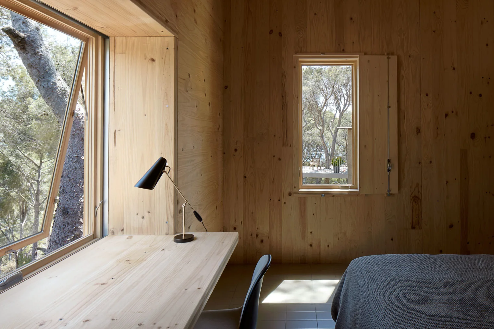 Where possible the homes also boast built-in timber furniture, including this desk in the bedroom