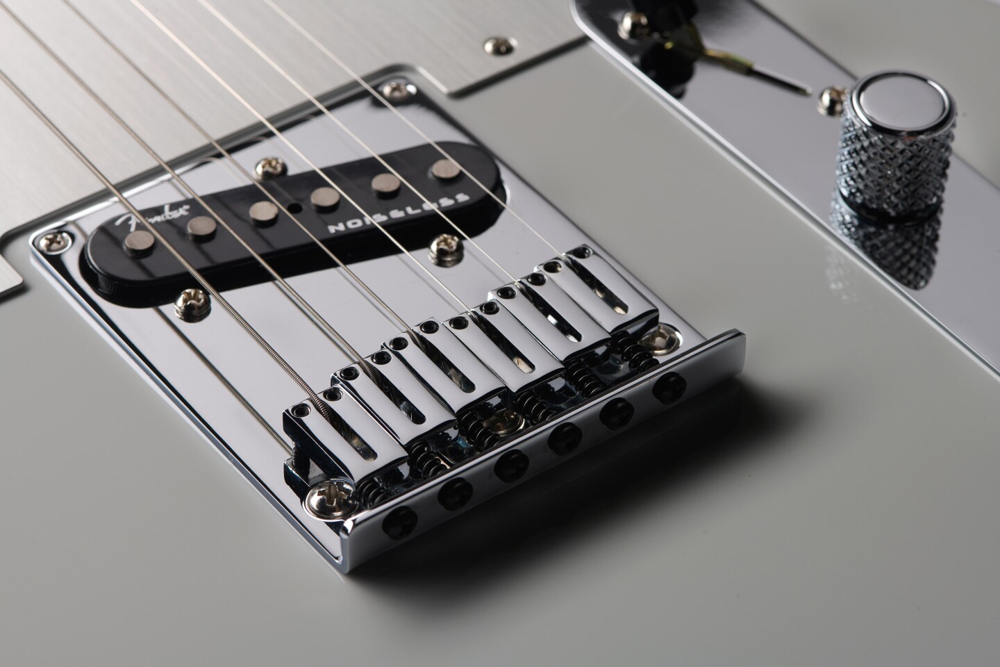 None of this three brass barrels and an ashtray business, the Ultra II uses chromed brass block saddles for individual intonation adjustment