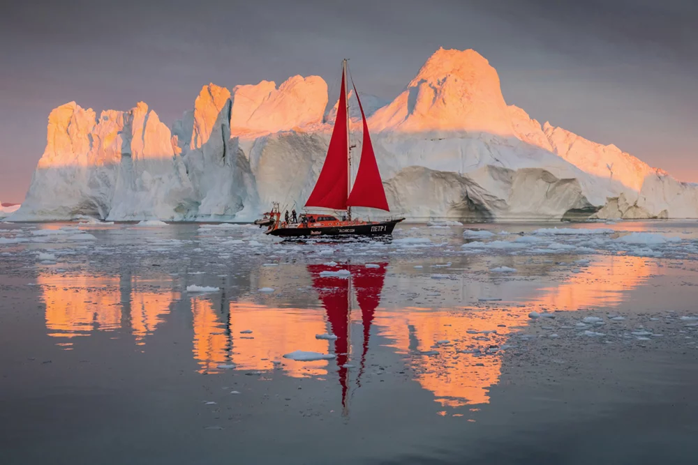 Winner of 2nd place in the Amateur Travel category: Tristan Lavender - Midnight sailing. The Ilulissat Icefjord, on the west coast of Greenland. Taken at midnight late July