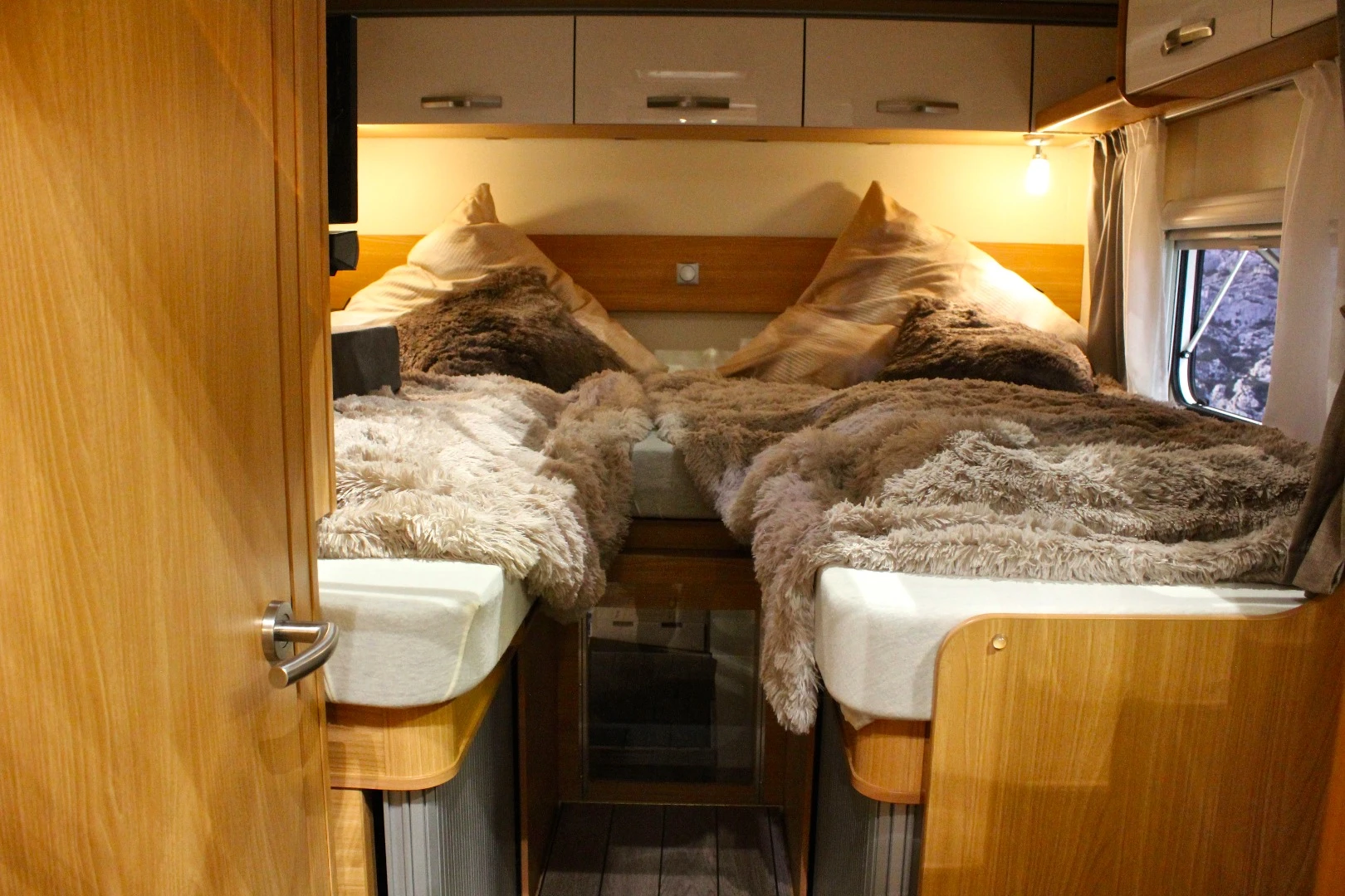 The rear bedroom includes a split double bed
