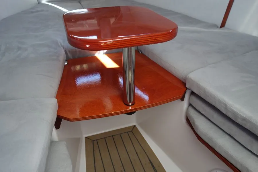 The two seats and table inside the 23cs's cabin convert to a double bed