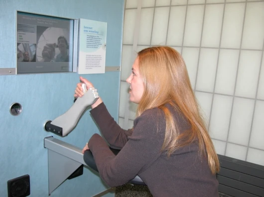 Wendy J. Brez tests out the machine at the New York Hall of Science in Queens, NY.