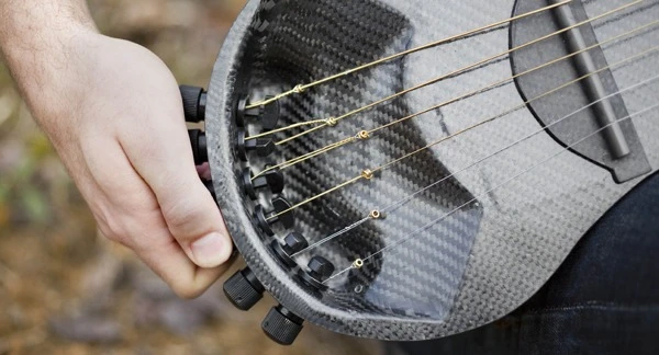 Steinberger gearless bass tuners are positioned left of the carbon fiber saddle