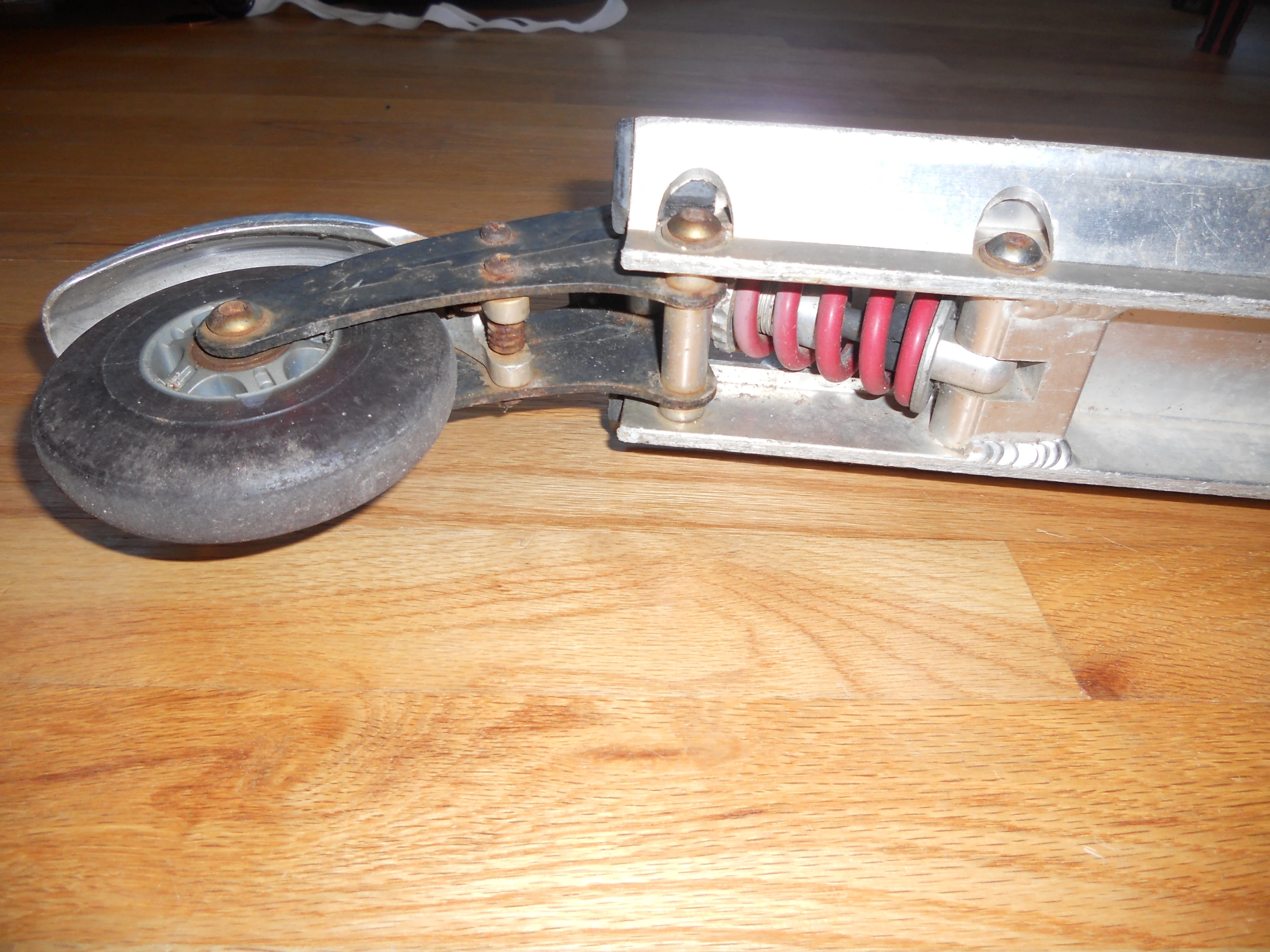 The rear shocks of the Royce Union Transit scooter