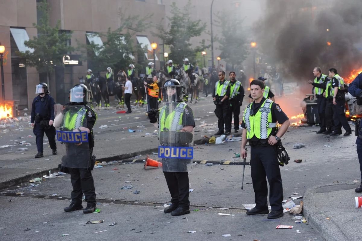 Riot police with conventional two-way shields, in Vancouver