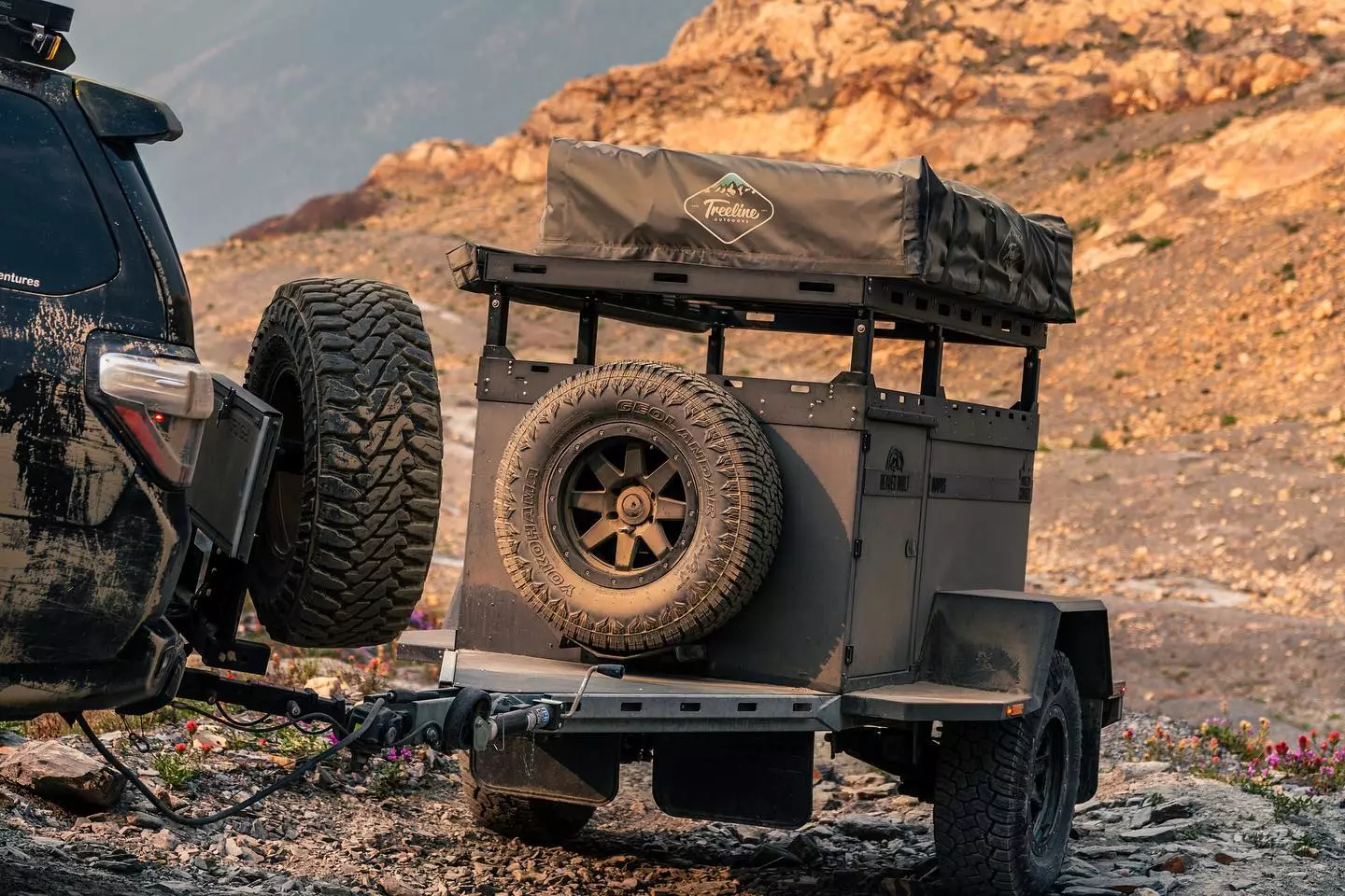 A Wapos with added spare tire and rooftop tent gets filthy in the backcountry