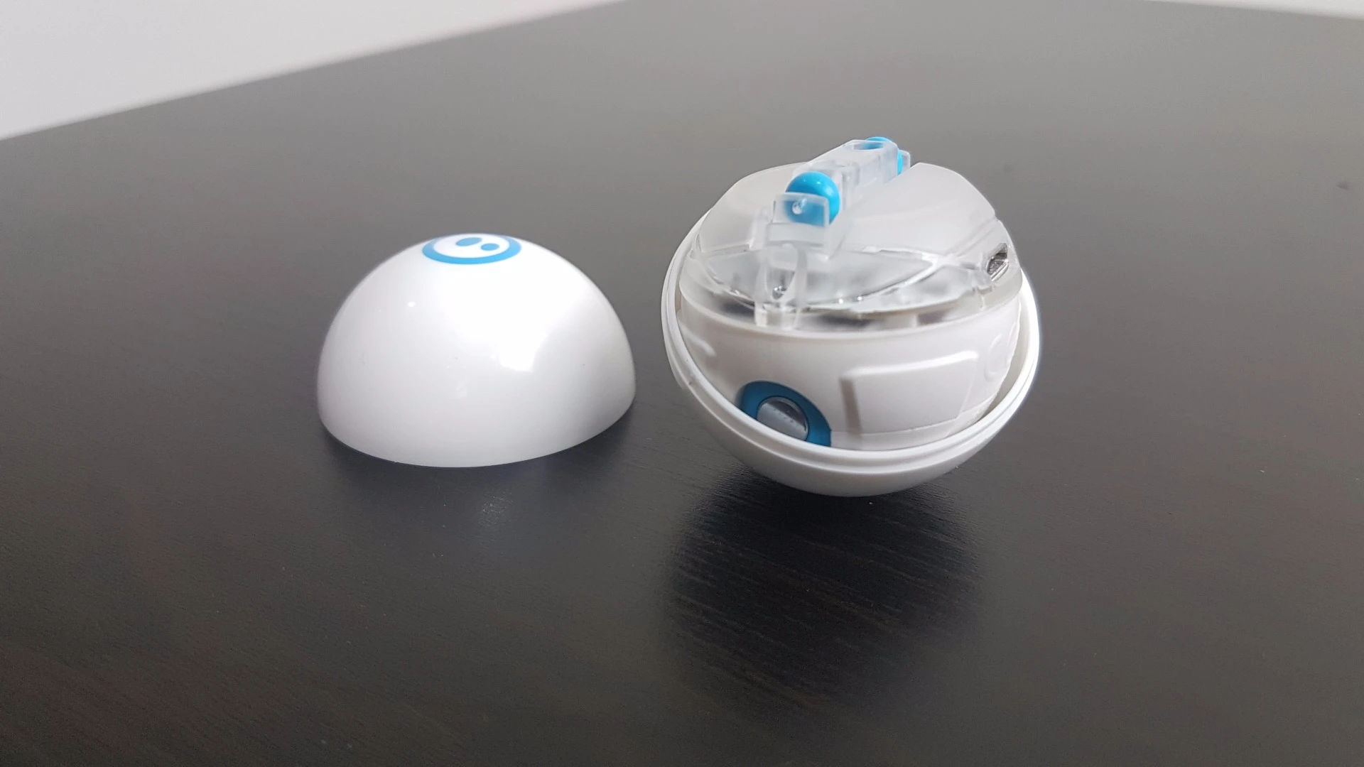 Rather than induction charging, Sphero Mini's shell cracks open to reveal a micro USB port inside