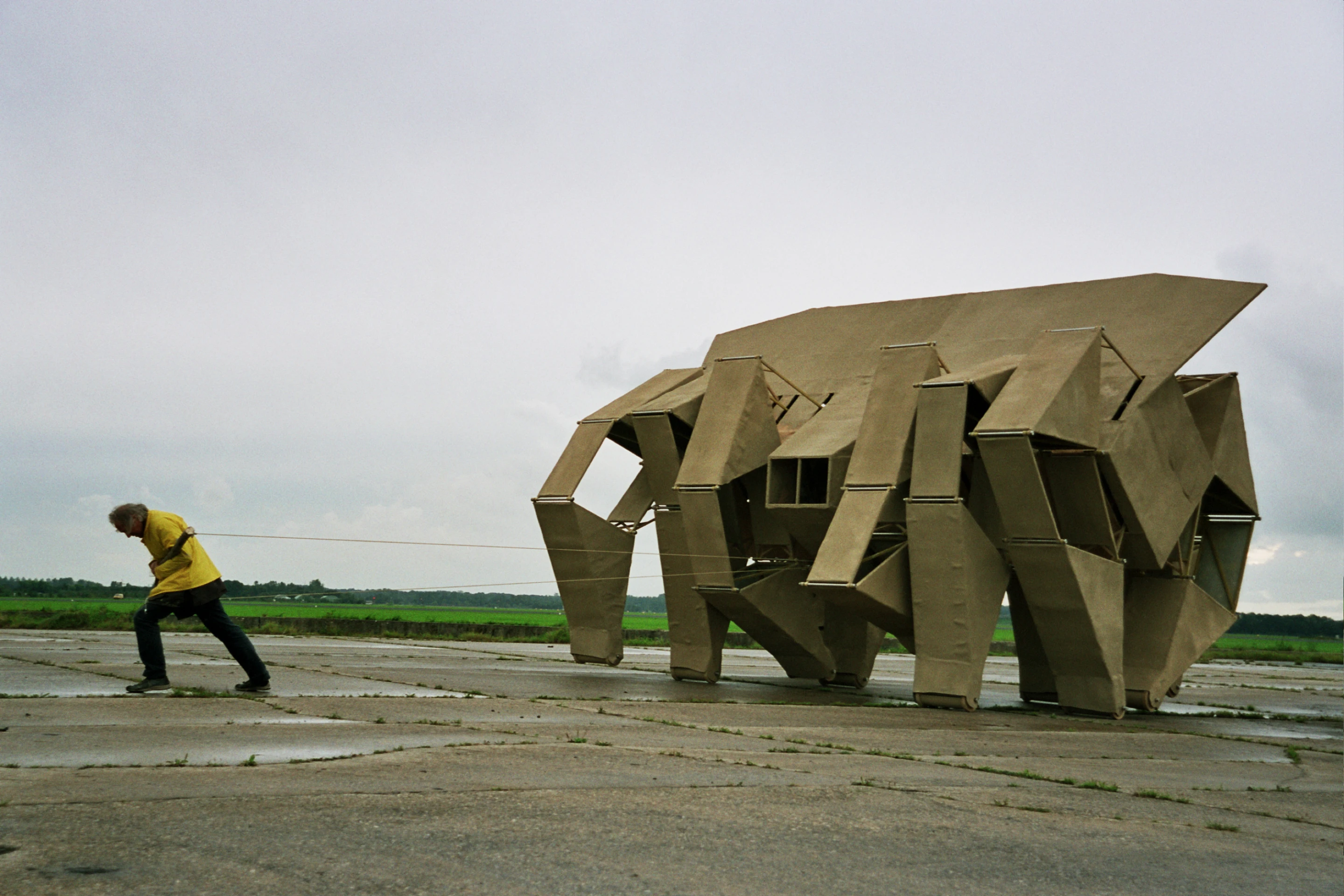 Theo pulls the wooden Animaris Rhinoceros, a two ton Strandbeest to set it in motion(Photo: Theo Jansen)
